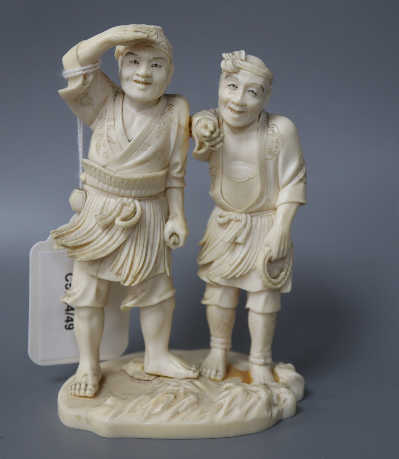 A Japanese ivory okimono of two gentlemen, height 13cm